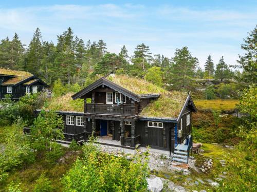 an image of a house with a grass roof at Cabin Between Mountain And Forest in Lampeland