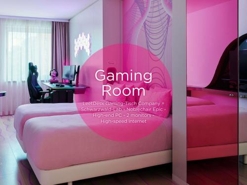 a room with a pink room with a bed at nhow Berlin in Berlin