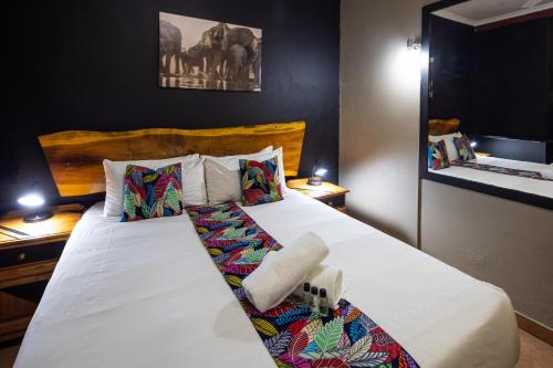 Ένα ή περισσότερα κρεβάτια σε δωμάτιο στο Eco Lodge Lephalale