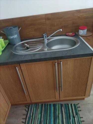 a sink in a bathroom with a counter at Cap à Gap - Charmant T2 plain pied avec extérieur in Gap
