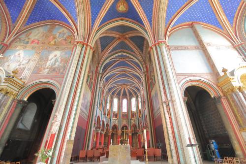 a large room with paintings on the ceilings of a cathedral at Hotel Des Deux Continents in Paris