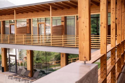 a view from the balcony of a house at Corona Dolomites Hotel in Andalo