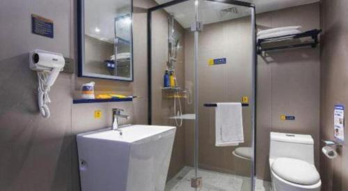a bathroom with a toilet and a sink and a shower at 7 Days Inn Nanjing Xinjiekou Changfu Street Metro Station in Nanjing