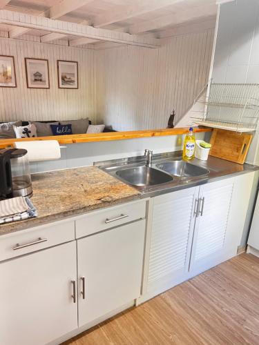 Kuchyň nebo kuchyňský kout v ubytování Domek Letniskowy