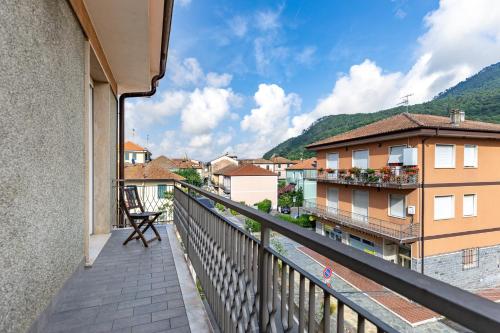 a balcony with a view of a city at Hostdomus - Altrove Apartment in Villanova dʼAlbenga