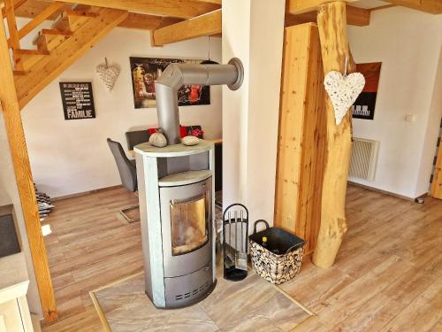 a wood burning stove in a living room at Ferienhaus Meeresrauschen am Salzhaff - ABC582 in Boiensdorf