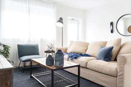 a living room with a couch and a table at Instant Stay Ocean Drive in Miami Beach