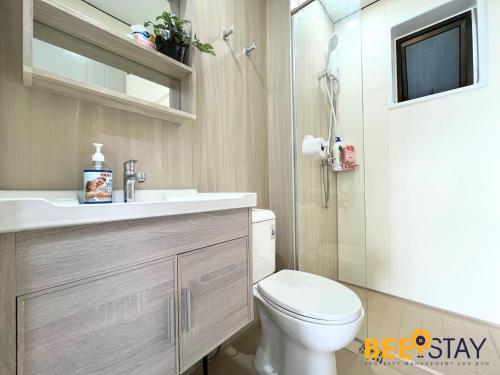 a bathroom with a toilet and a sink and a shower at Youth City Residence Family Suite KLIA AEON Mall Nilai USIM in Nilai