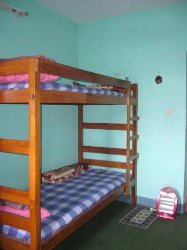 a bunk bed room with two bunk beds at Sanu House in Pātan
