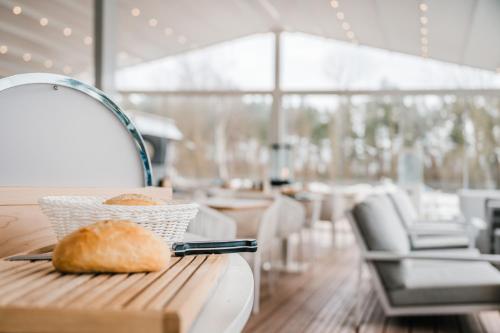 a basket of bread sitting on a table in a restaurant at Marina Martinshafen in Sassnitz