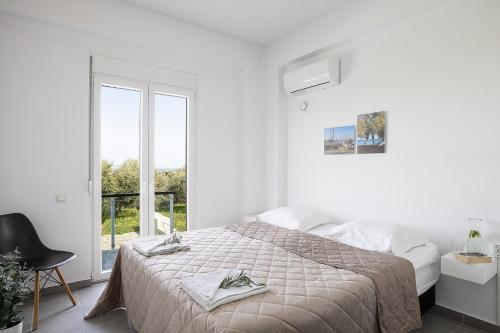 Ένα ή περισσότερα κρεβάτια σε δωμάτιο στο Villa Elies
