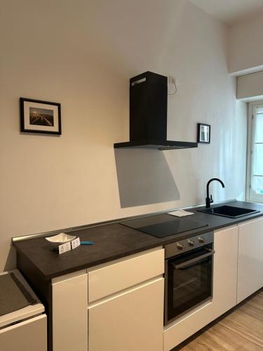 a kitchen with a sink and a stove top oven at AP Casa Sarnico in Sarnico
