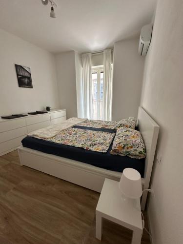 a small bedroom with a bed and a window at AP Casa Sarnico in Sarnico