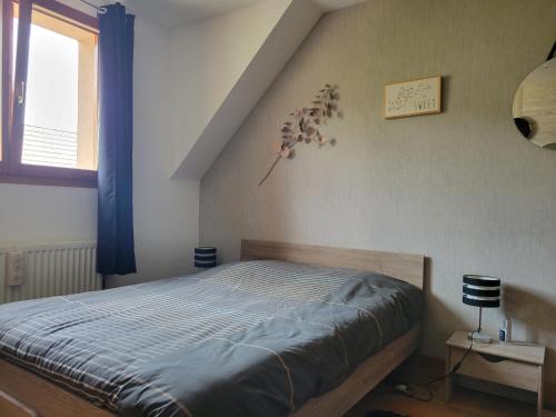 Postel nebo postele na pokoji v ubytování Le jardin