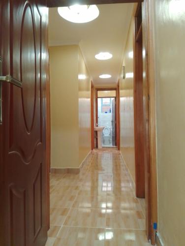 a hallway with a door leading to a bathroom at JOSH HOME's in Ruiru