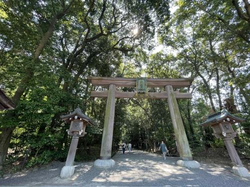a large wooden gate in a park with trees at 宿Joan in Sakurai