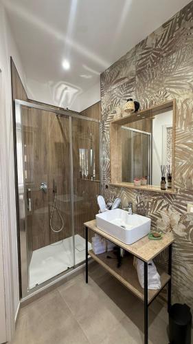 a bathroom with a sink and a shower at Flower rooms Palermo in Palermo