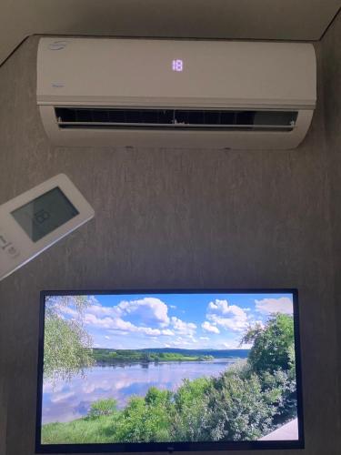 a flat screen tv in the ceiling of a train at River view in Soroca