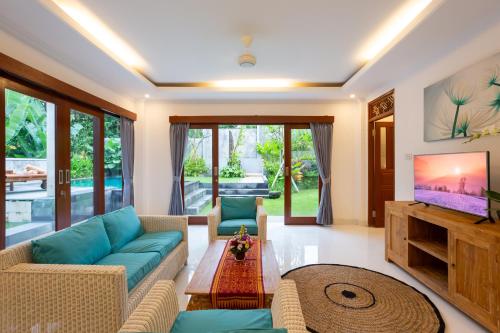 Телевизор и/или развлекательный центр в Villa Uma Sari Dayuh Between Canggu & Ubud