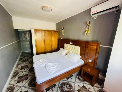 Postel nebo postele na pokoji v ubytování Hotel Résidences des Hotes
