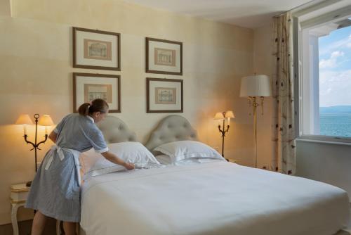 Postel nebo postele na pokoji v ubytování Hotel Rivalago