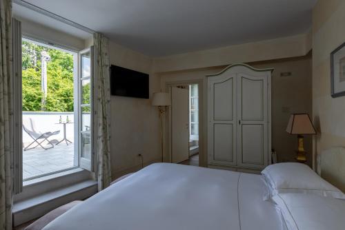 Postel nebo postele na pokoji v ubytování Hotel Rivalago