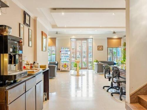 a large room with a kitchen and a living room at Hotel City Premier - Golf Course Road ,Gurgaon in Gurgaon
