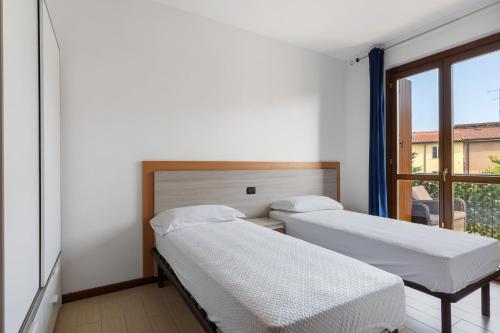 Ένα ή περισσότερα κρεβάτια σε δωμάτιο στο Casa Vacanze da Ricky App 5