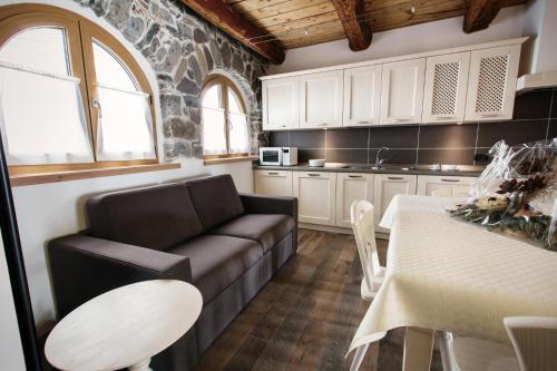 a living room with a couch and a table at Da Nocent in Paluzza