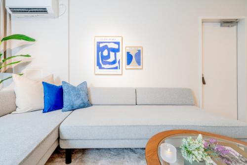a living room with a couch and a table at Ken's Place Azabu-Juban in Tokyo