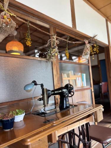 a sewing machine sitting on top of a table at Vineyard Vista ENZAN in Koshu