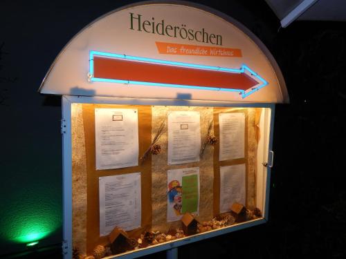 a sign for a ticket booth at a restaurant at Airport Fashion Hotel in Düsseldorf