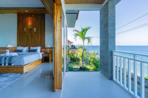 Katil atau katil-katil dalam bilik di Sekar Penida Cottages by Bukit Vista