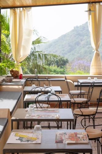 a row of tables and chairs in a restaurant at Tenuta Santa Tecla in Acireale