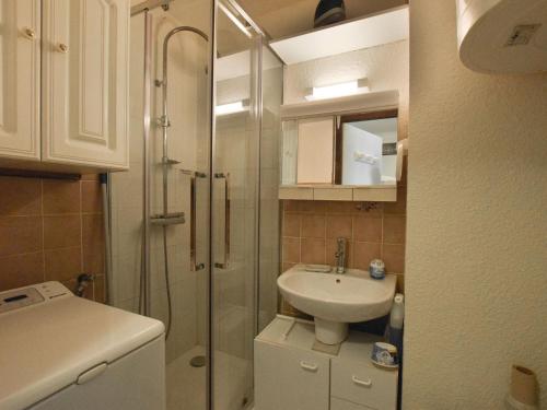 a small bathroom with a sink and a shower at Studio cosy à Bernex avec terrasse et parking - FR-1-498-92 in Bernex