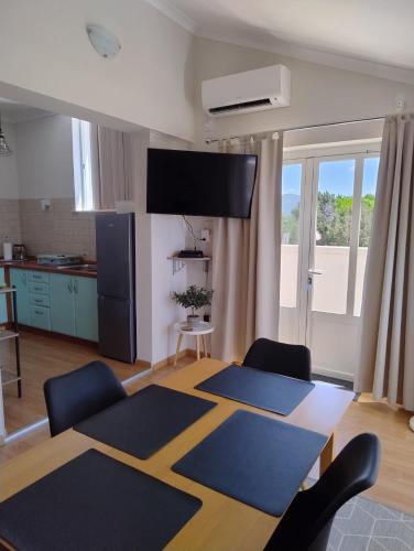a living room with blue mats on the floor at Planika Apartments 2 in Korčula