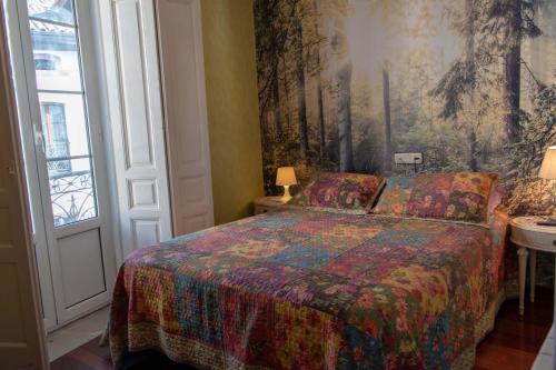 En eller flere senge i et værelse på APARTAMENTOS Casino