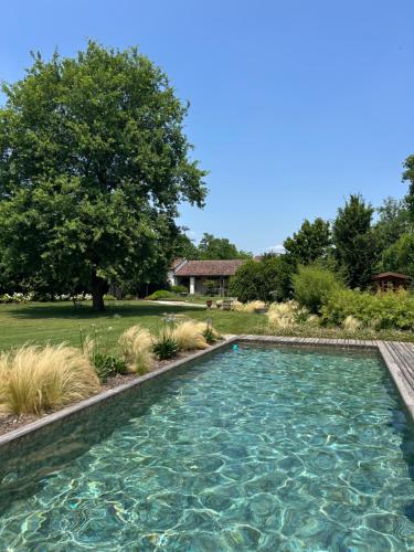 a swimming pool in the middle of a yard at Il Glicine - Natural BnB in Castello di Godego