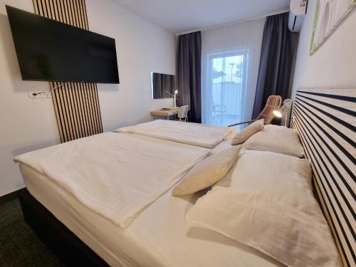 Postel nebo postele na pokoji v ubytování Hotel Bio