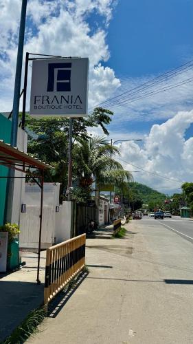 a sign for a pharmacy on a street at Frania Boutique Hotel in San Juan