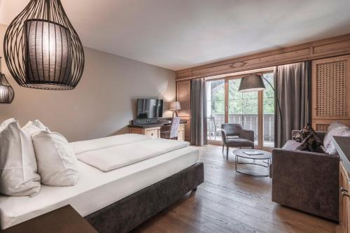A bed or beds in a room at Engel Gourmet&Spa