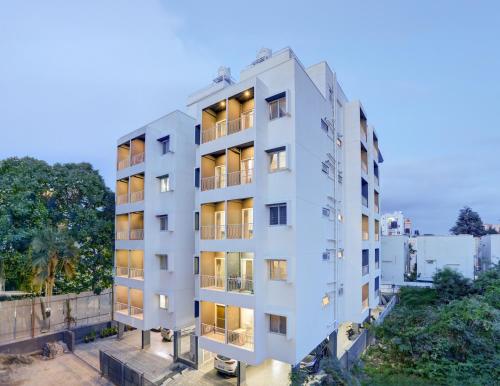 an overhead view of a white apartment building at Acasa Suites - ITPL Whitefield, Near Manipal Hospital in Bengaluru