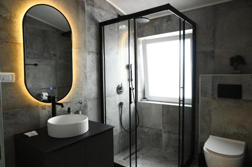 a bathroom with a sink and a mirror at Villa Vista in Bitola