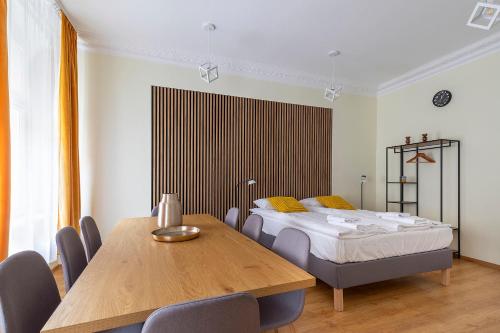 Ένα ή περισσότερα κρεβάτια σε δωμάτιο στο Apartamenty ADM Półwiejska 16