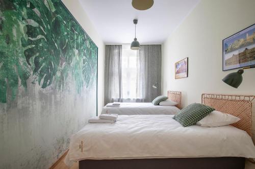 Ένα ή περισσότερα κρεβάτια σε δωμάτιο στο Apartamenty ADM Półwiejska 16