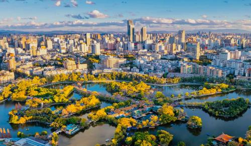 an aerial view of a city with trees and buildings at Kunming Meihao Lizhi Hotel Cuihu Park Yunnan University Hospital Branch in Kunming