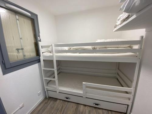 a small room with white shelves and a mirror at Appartement cosy 4 pers, proche pistes et commerces - FR-1-733-169 in Cohennoz
