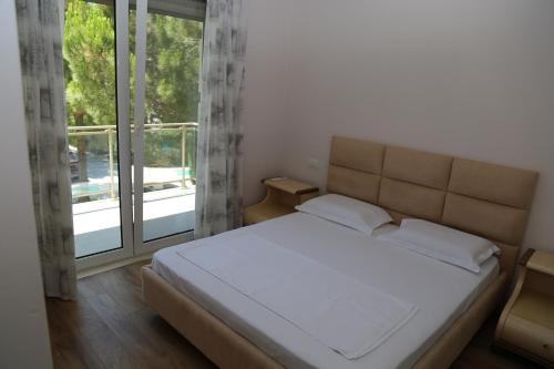 Ένα ή περισσότερα κρεβάτια σε δωμάτιο στο Artino