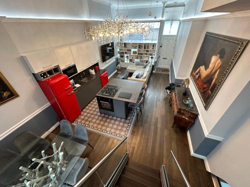 an overhead view of a kitchen and living room at Unique Luxury Home in the heart of London. Air conditioned with private garden in London