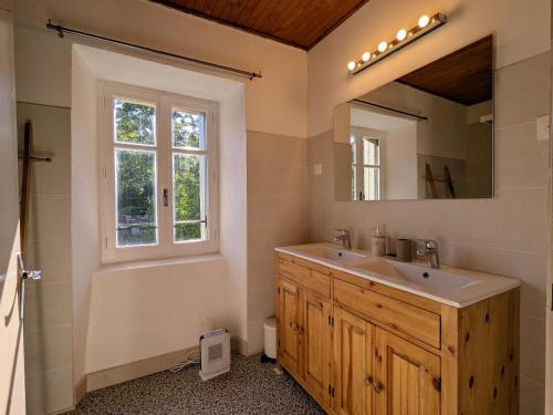 a bathroom with a sink and a mirror at Gîte de caractère rénové, jusqu'à 10 pers., jardin privé, Haute-Loire - FR-1-582-534 in Saint-Arcons-de-Barges